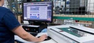 A Labelink employee uses GlobalVision Graphics and Text Inspection